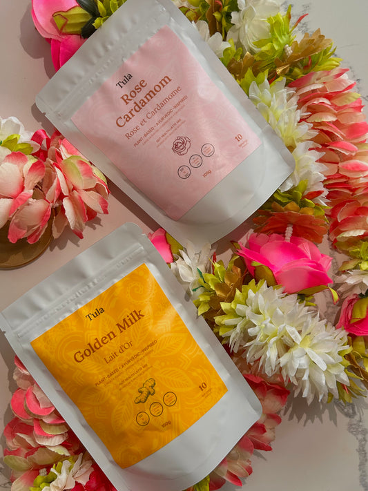 Two Tula fiber latte products on a floral background